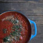 A photo of tomato sauce is a dutch oven.