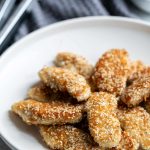 A combination of sesame seeds and panko breadcrumbs makes these chicken fingers incredibly crunchy! The peanut dipping sauce pairs perfectly.