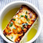 baked feta in a ramekin with honey and thyme