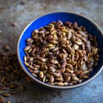 Sweet and Spicy Maple Roasted Pumpkin Seeds in a bowl
