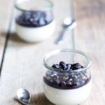 Buttermilk panna cotta recipe topped with blueberry compote, served in two mason jars