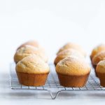 Cardamom cinnamon sugar muffins on a cooling rack