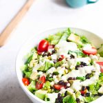 Mexican chopped salad topped with salad dressing